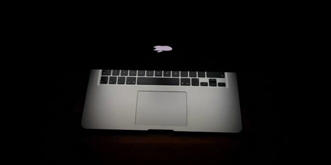 Macbook partially closed in the dark